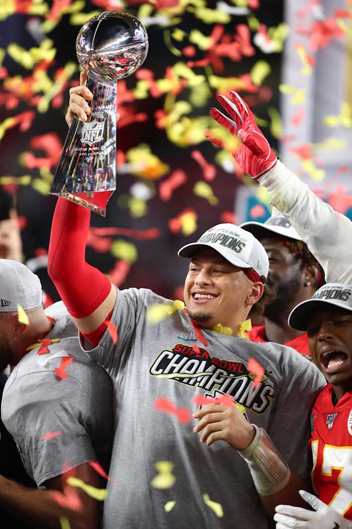 Chiefs quarterback Patrick Mahomes (15) celebrates with the Vince Lombardi Trophy after defeating the 49ers in Super Bowl LIV at Hard Rock Stadium.